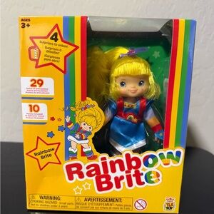 Rainbow Brite 5.5” tall. Comes with 4 mystery surprises. New in box